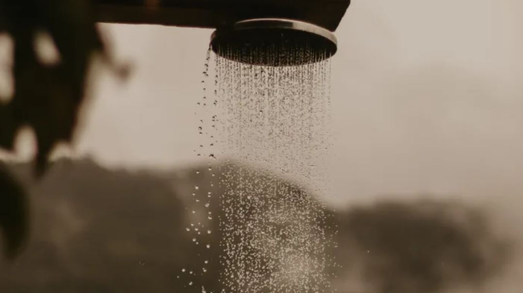 Running water representing gentle soap-free facial cleansing