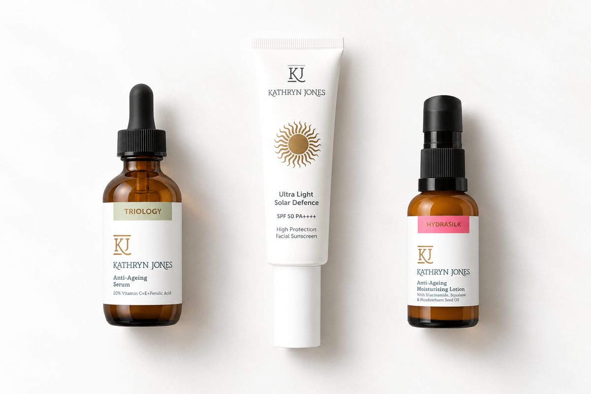 KJ Serums Triology Vitamin C serum, Solar Defence SPF50 PA++++ sunscreen and HydraSilk facial moisturiser arranged on a clean white background