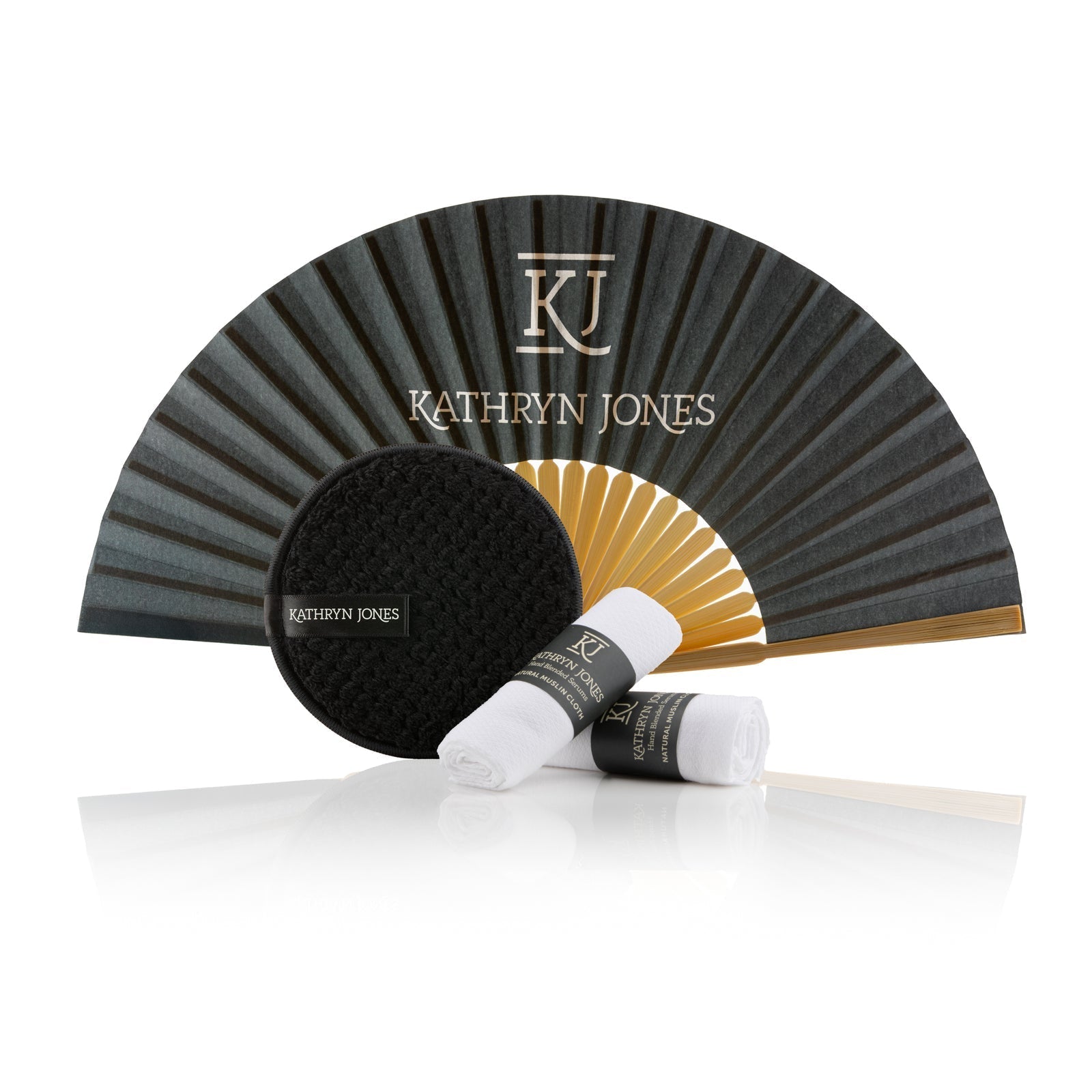 Kathryn Jones makeup products including a fan, brush, and two bottles on a white background