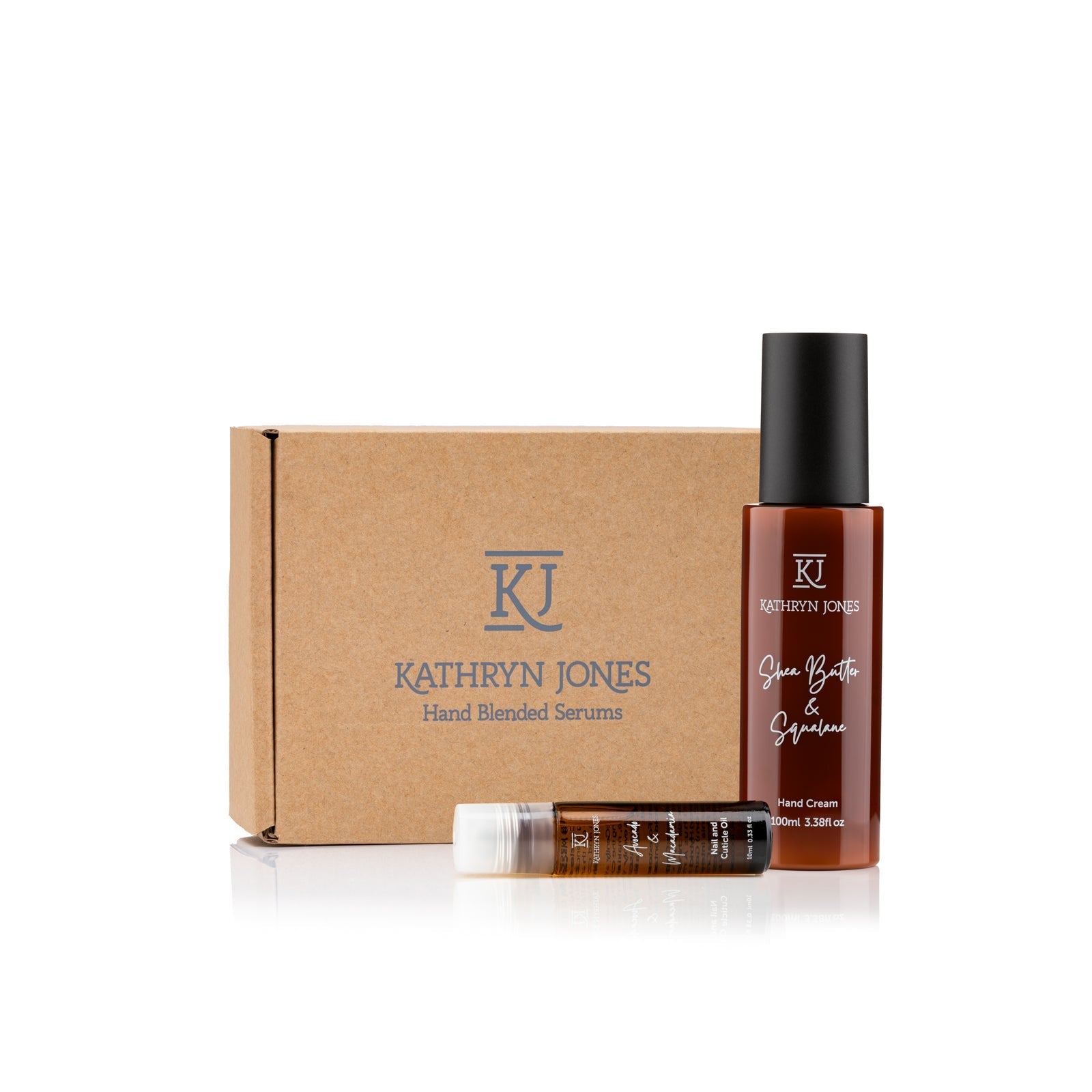 Kathryn Jones hand blended serums and cream with a cardboard box on a white background
